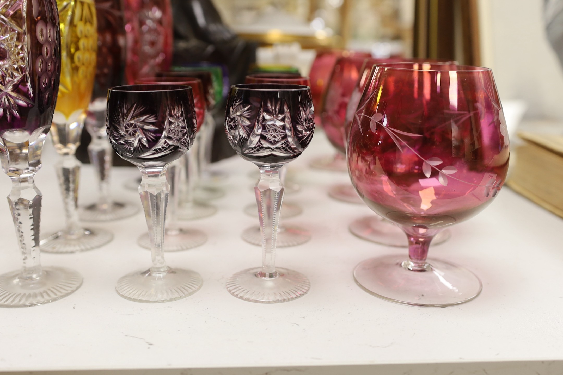 A group of mixed coloured bowl wine glasses